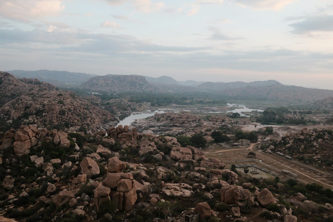 Valley and river view over the Hampi landscape from a hilltop viewpoint