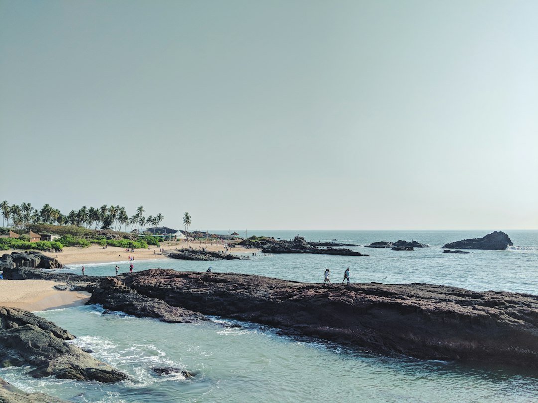 Island off the Udupi coast in Karnataka with clear water and shells